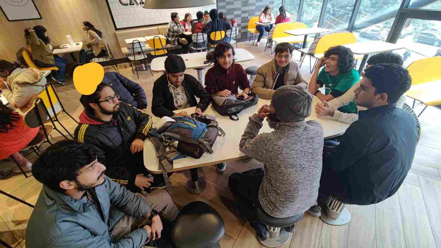 Photo of mappers eating in a McDonald's store.